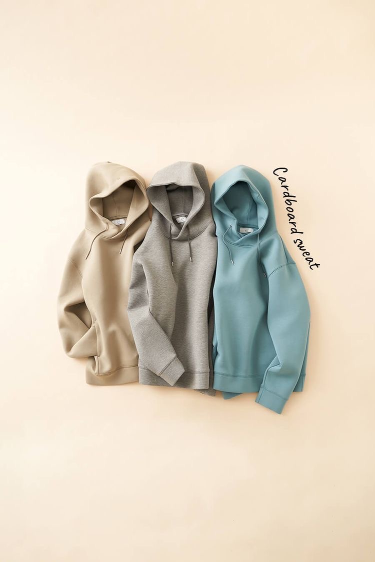 Three premium hoodies laid flat