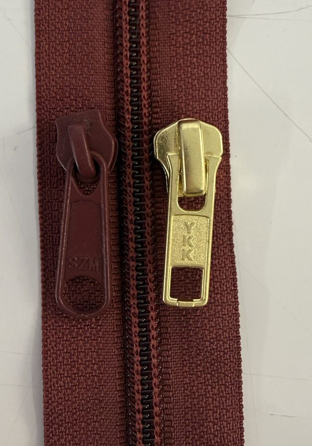 Zip with two pullers, one of the trims used in Eli & Co garment and bag production